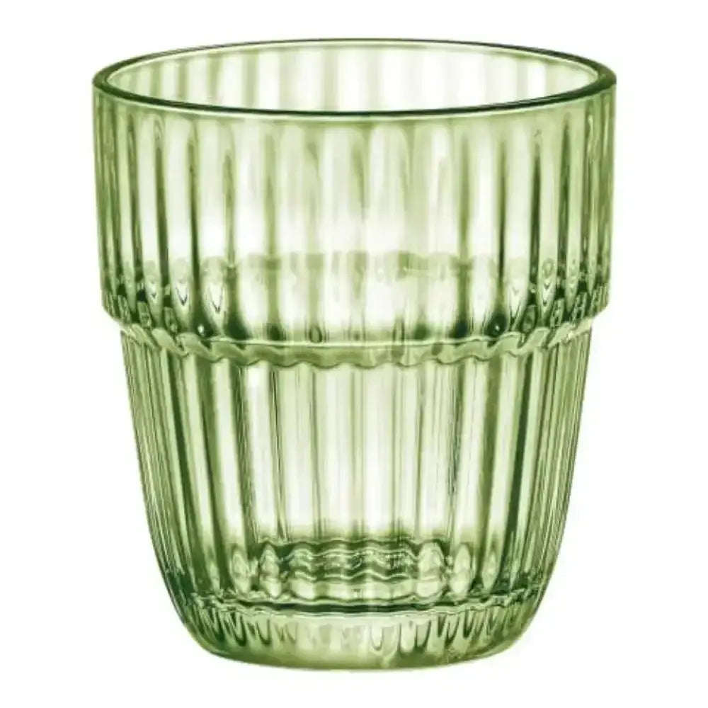 Green glass tumbler with ribbed texture on a white background