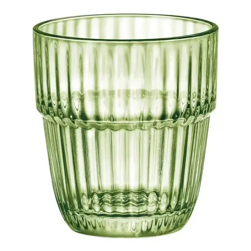 Green glass tumbler with ribbed texture on a white background