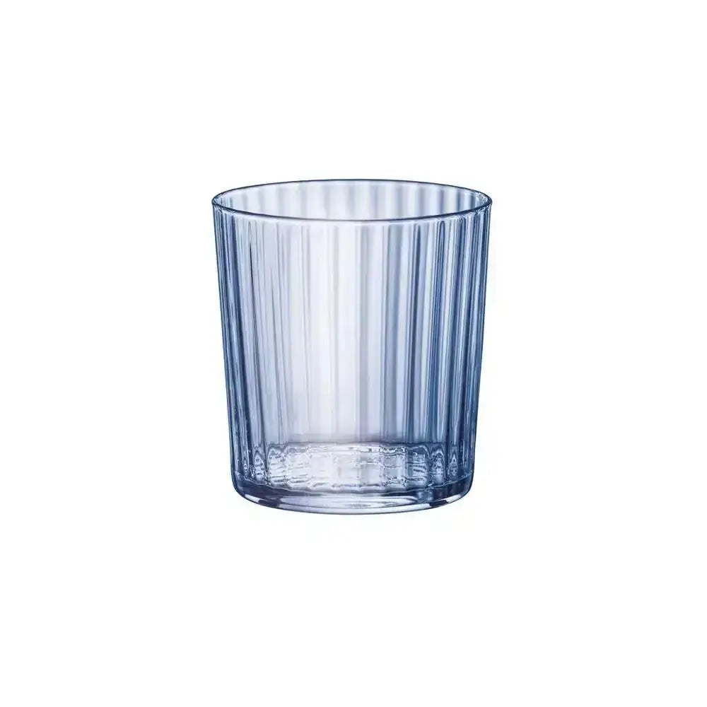 Clear glass tumbler with vertical stripes on a white background