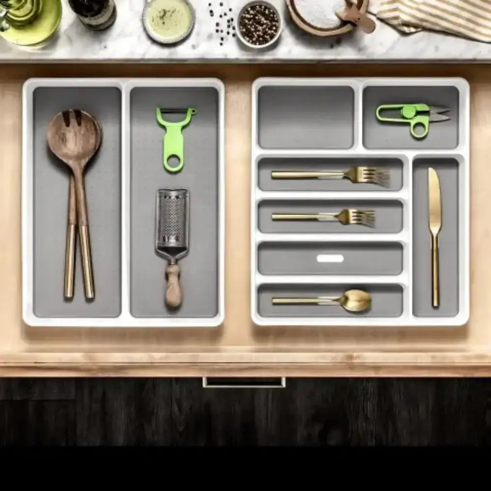 Madesmart classic antimicrobial white segmented expandable kitchen organizer holding wooden spoons gold forks and oxo good grips peeler