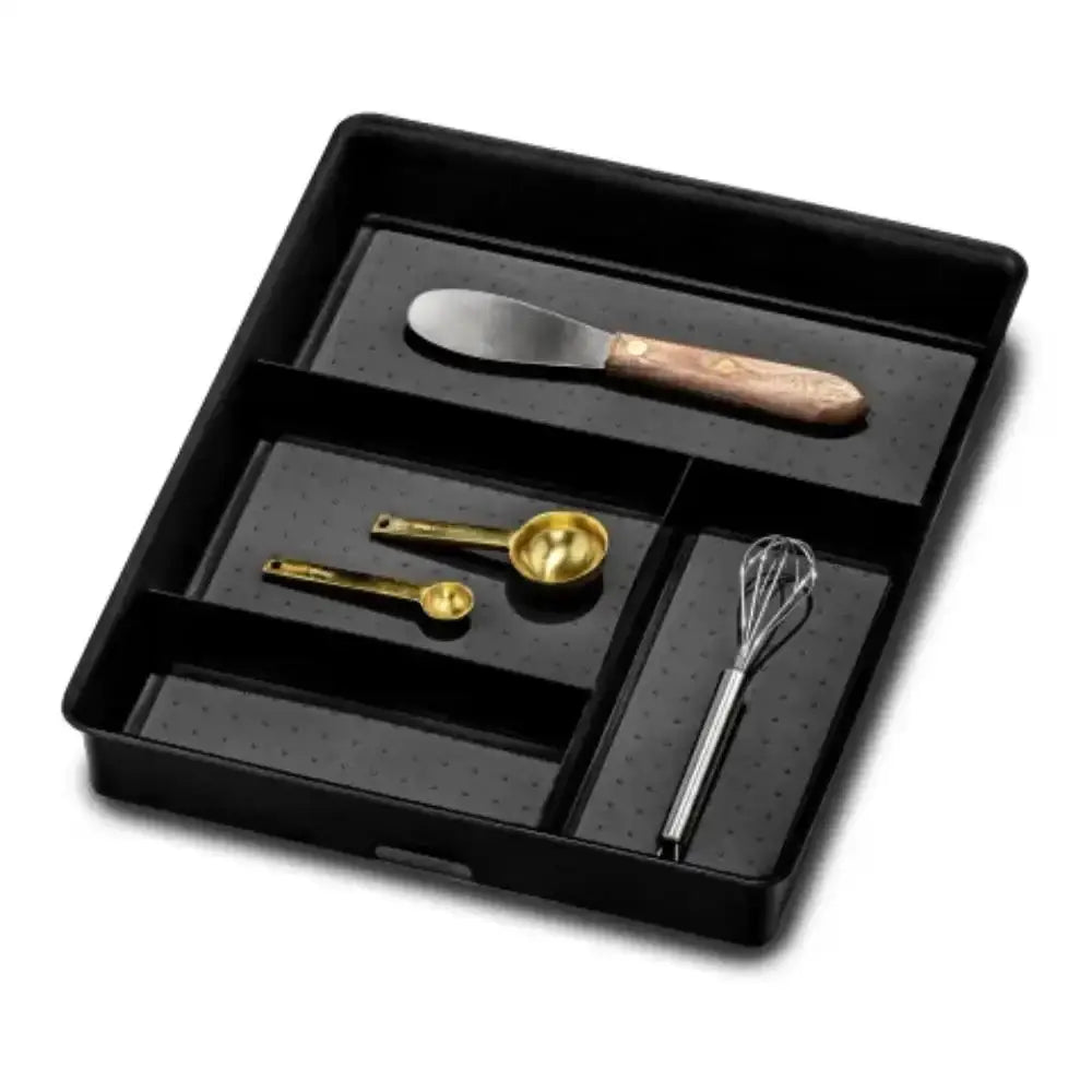Set of kitchen utensils including a knife, spoons, and a whisk in a black tray on a white background.