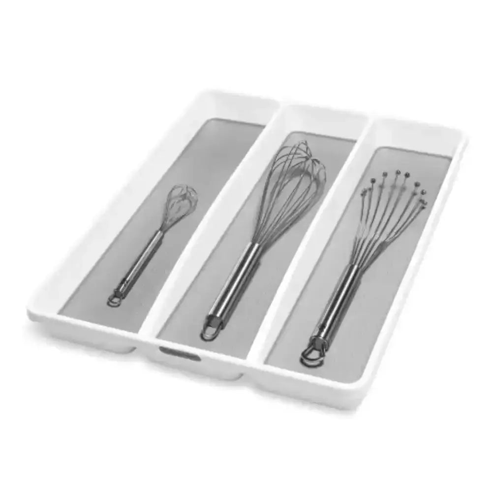Set of three whisks in a white tray on a white background