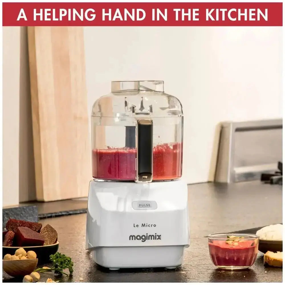Magimix food processor with a red smoothie on a kitchen counter