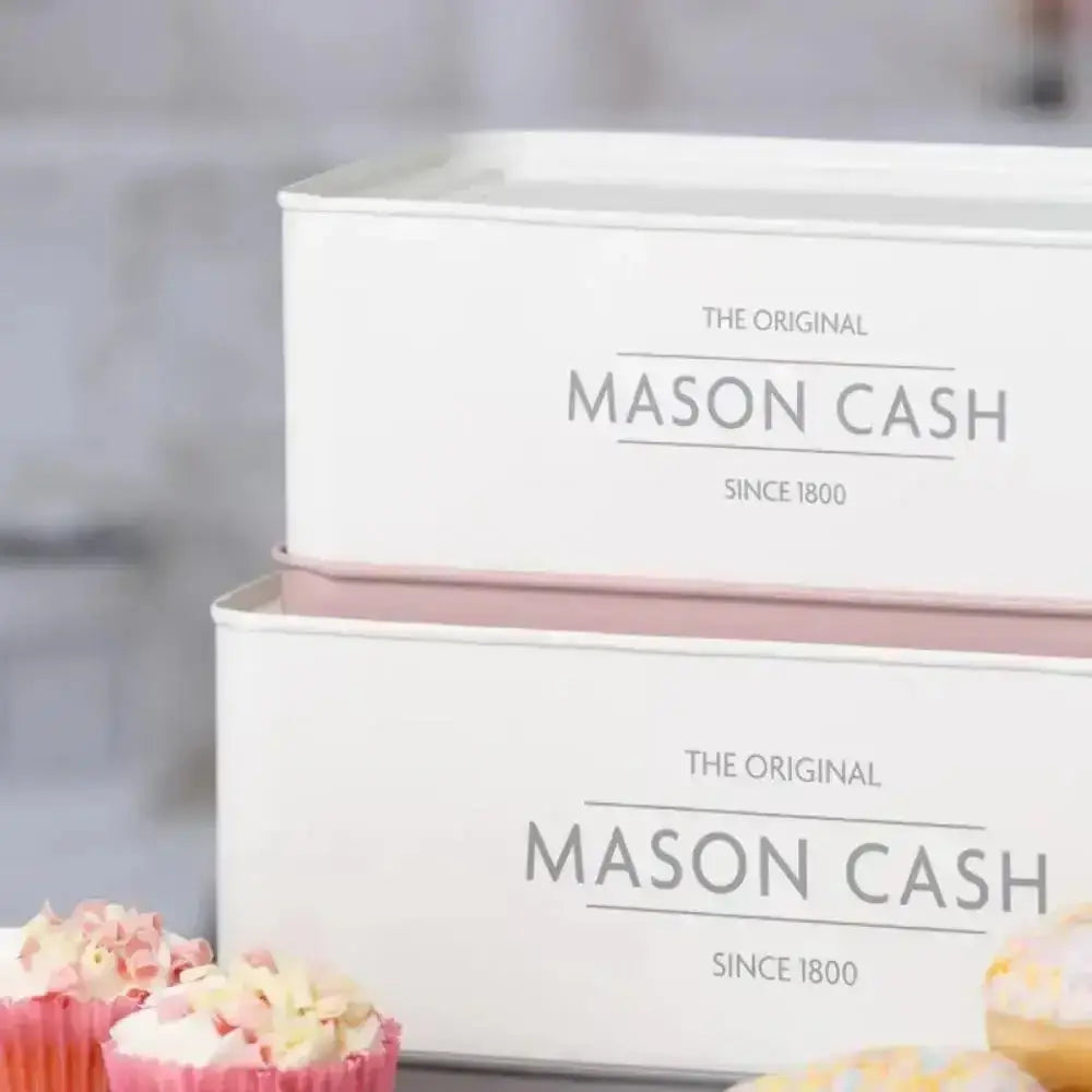 Two white storage boxes with 'Mason Cash' branding on a blurred background.