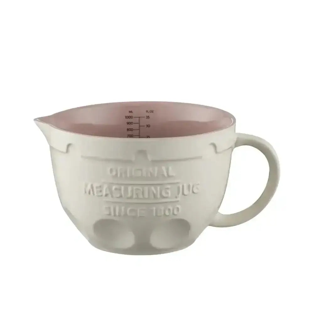 Cream-colored ceramic Mason Cash Innovative measuring jug 1L with pink interior and embossed official measuring jug text