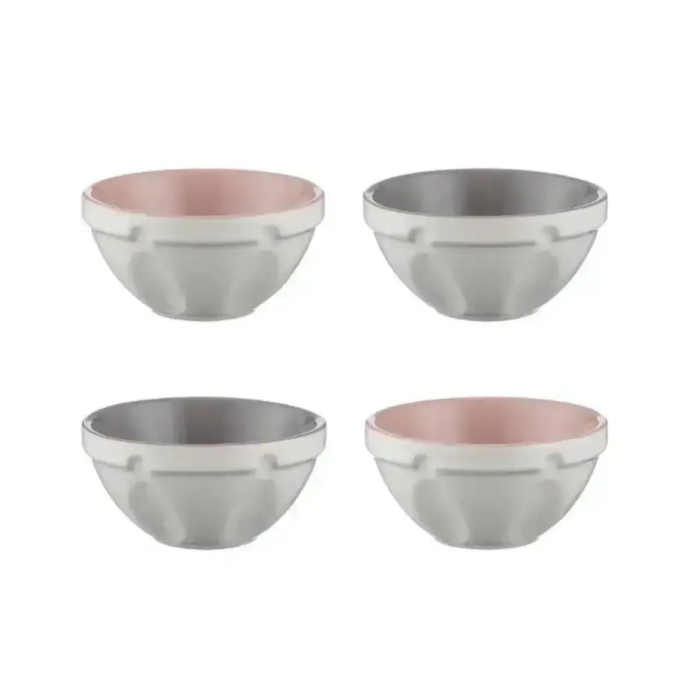 Set of four mason cash ceramic mixing bowls with matte gray exterior and pink or silver ribbed interiors for food prep
