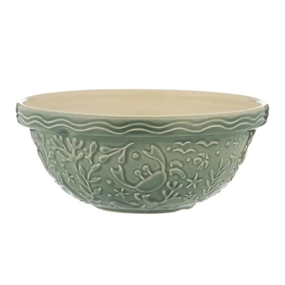 Green ceramic bowl with decorative patterns on a white background