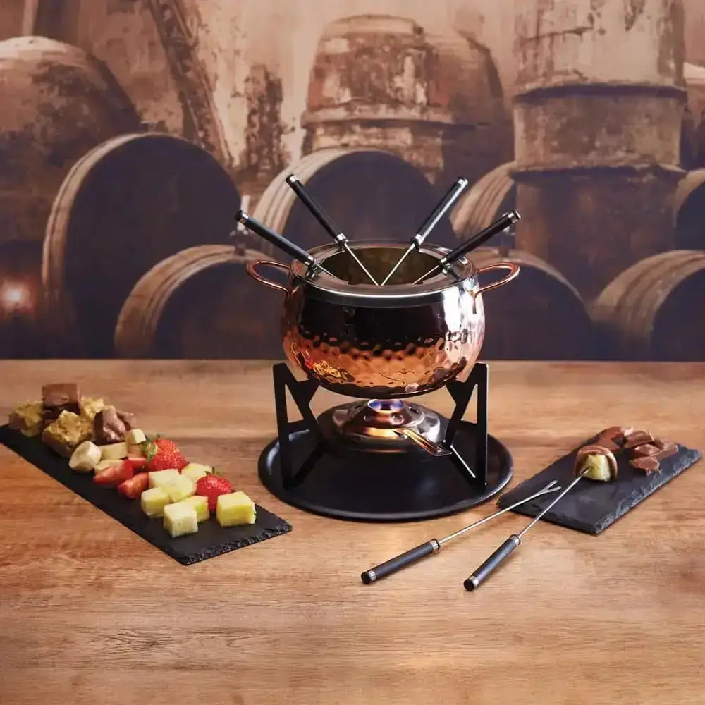 Fondue set with skewers on a wooden table against a rustic background