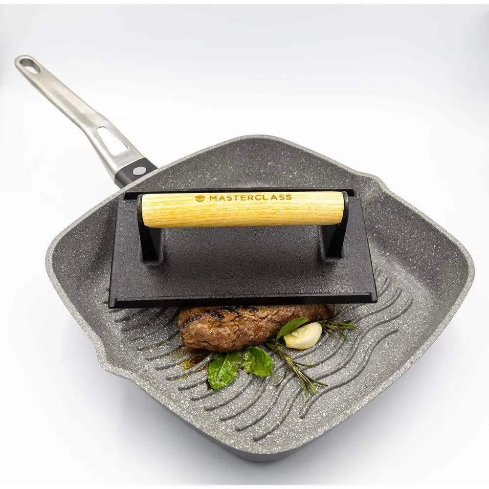 Square frying pan with grill plate and wooden handle, featuring 'Masterclass' branding.