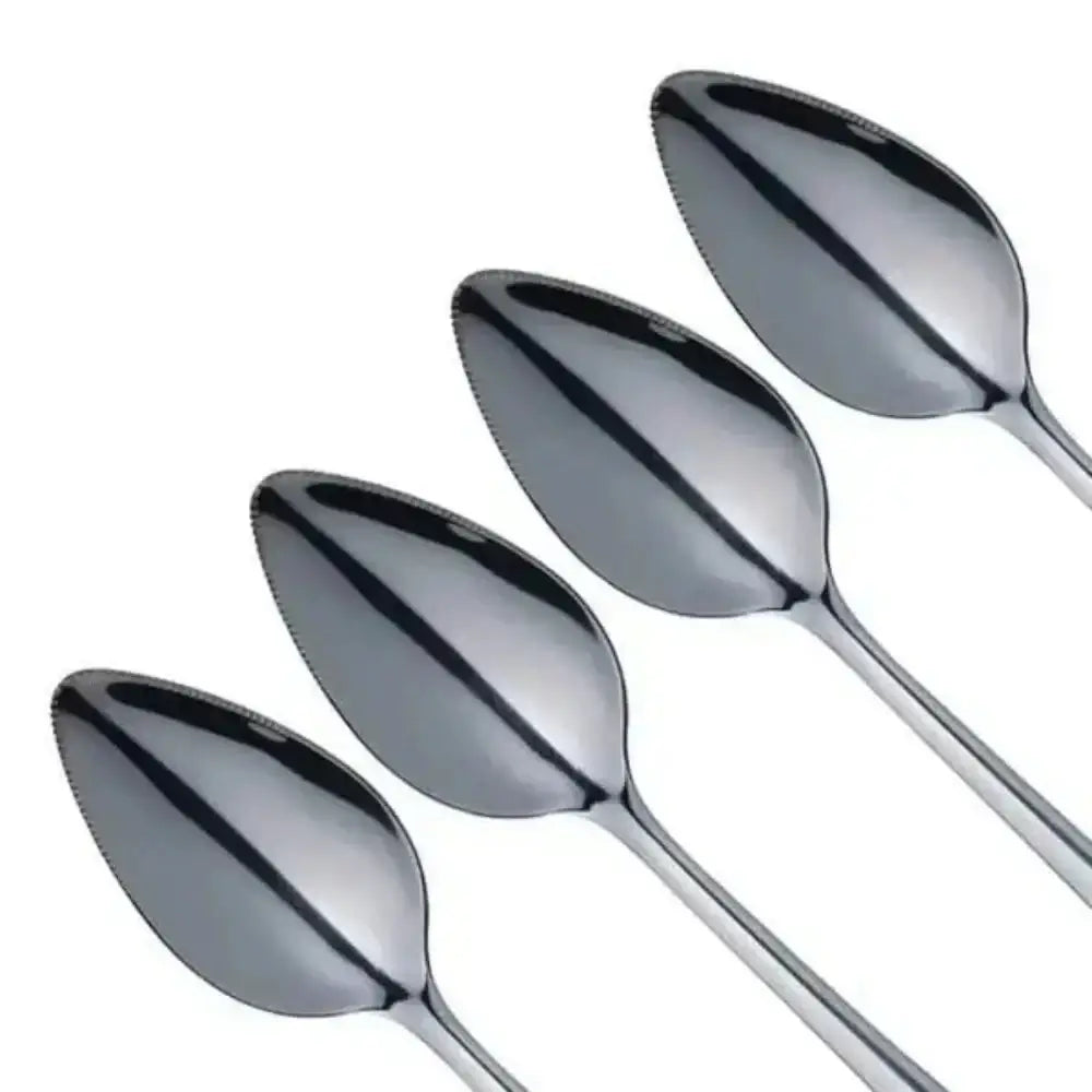 Set of five silver spoons on a white background