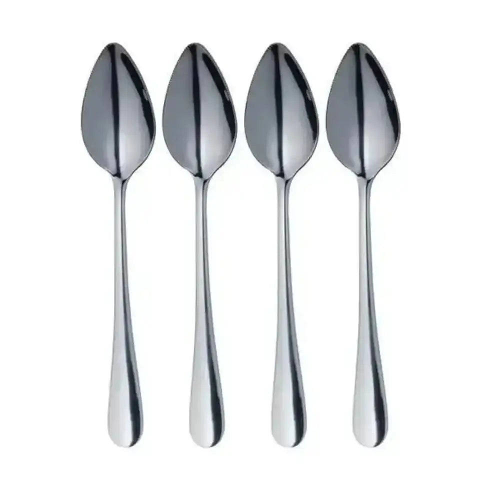 Four silver spoons on a white background