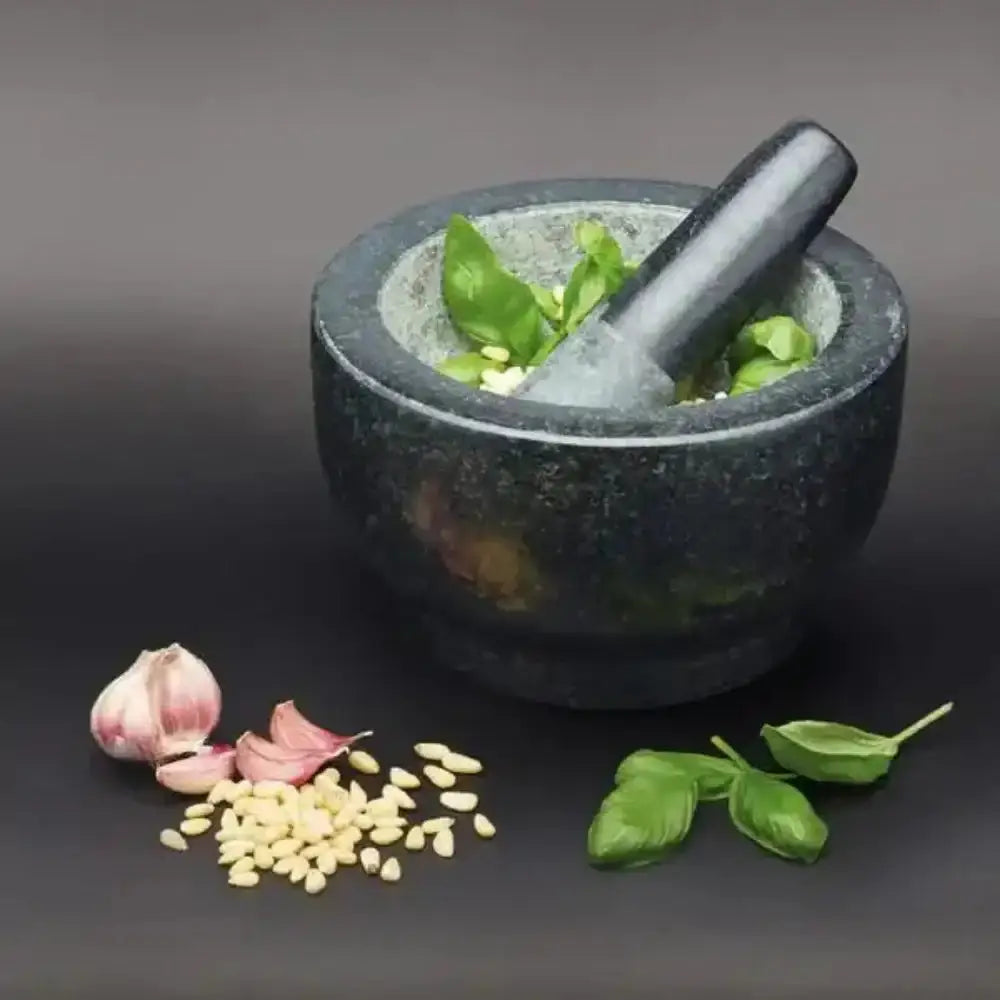 Mortar and pestle with ingredients on a dark background