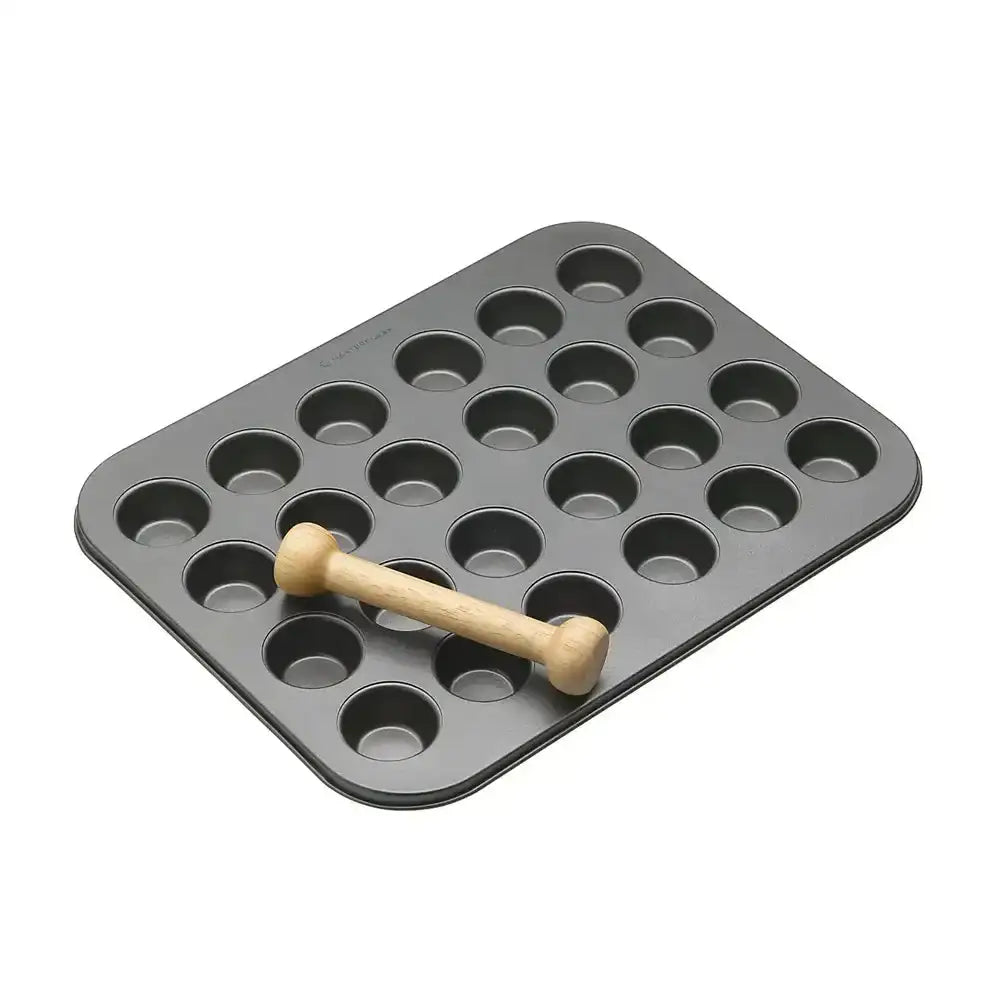 Gray muffin tin with a wooden handle on a white background