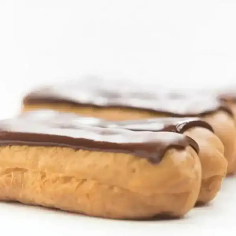 Eclairs with chocolate glaze on a white background