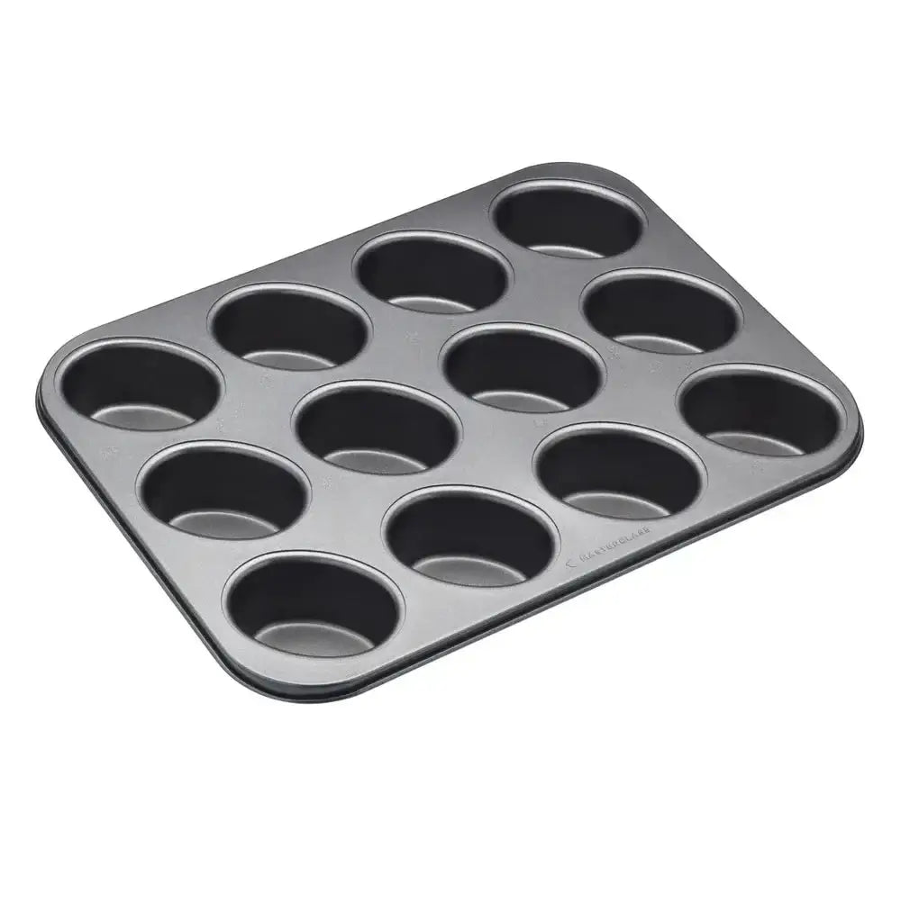 Muffin tin with 12 cups on a white background