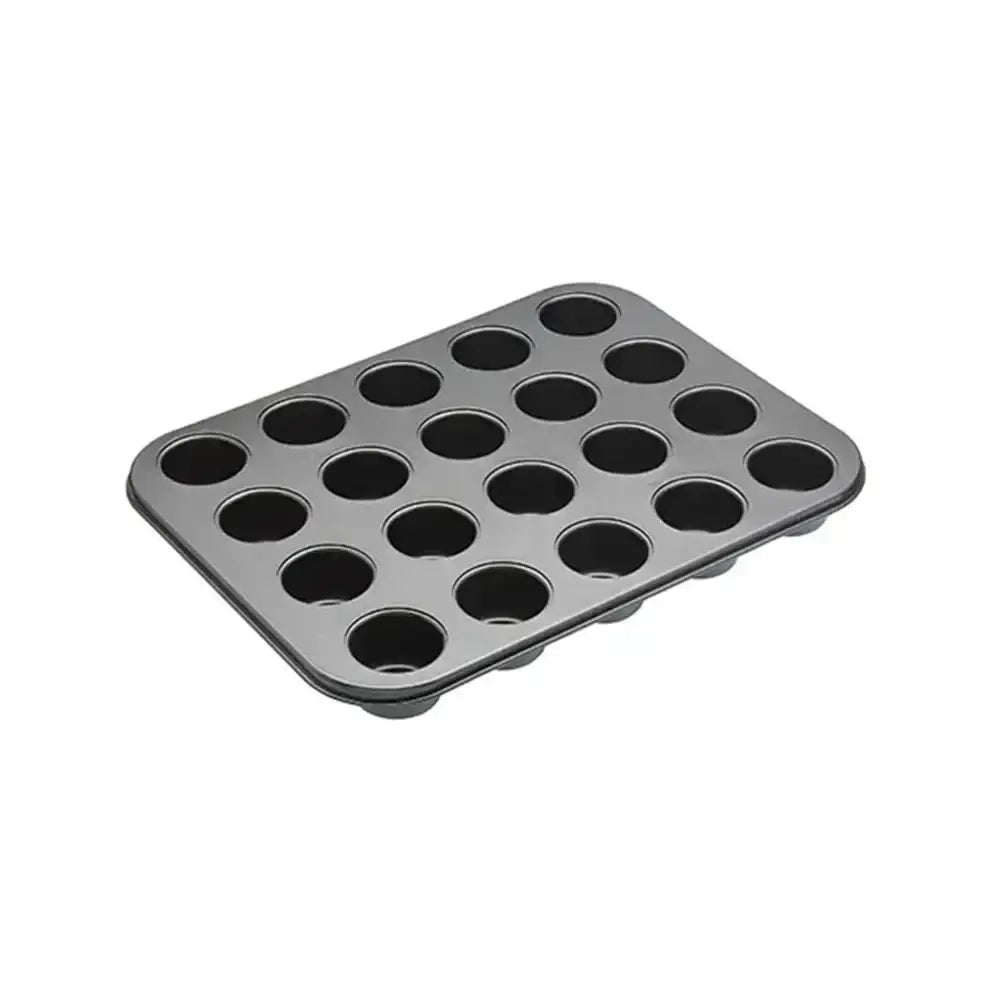 Metal muffin tin with 20 compartments on a white background