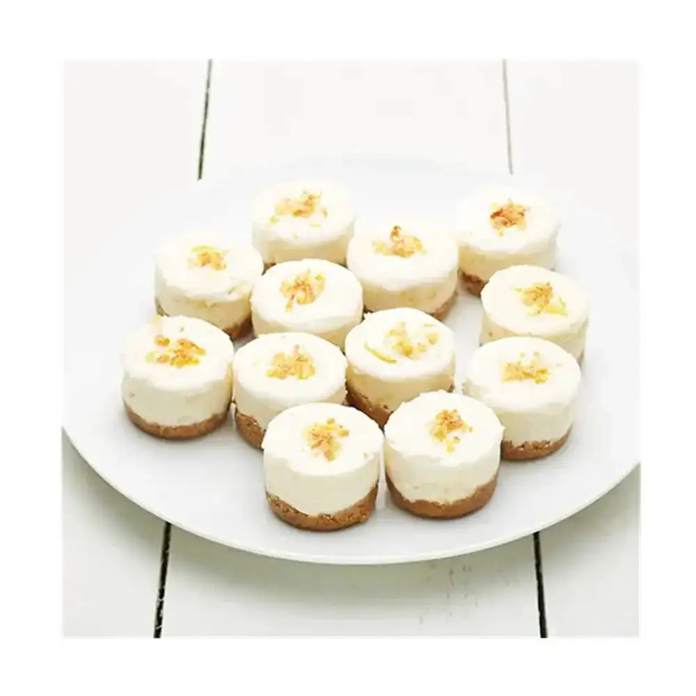 Plate of mini cheesecakes with a white background