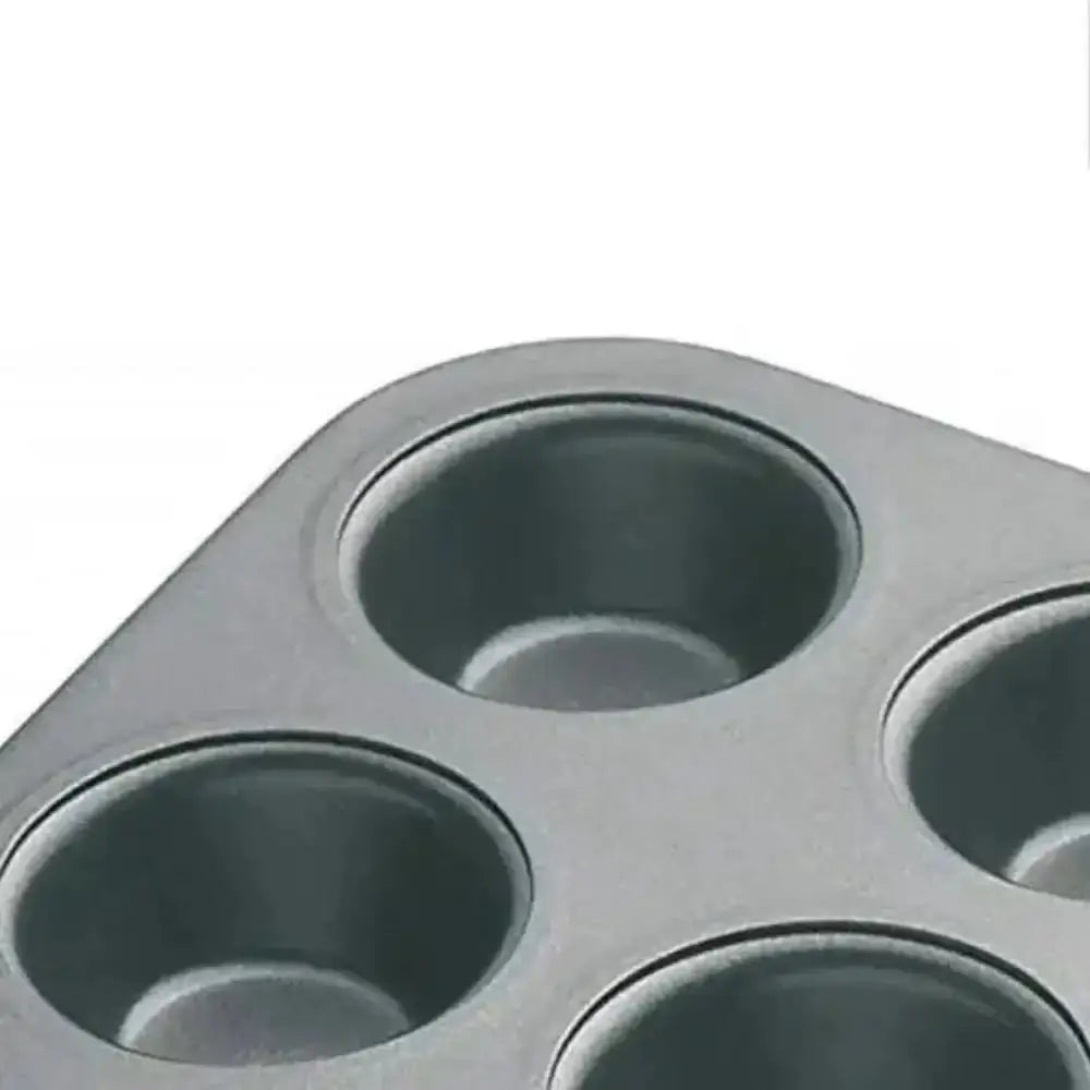 Metal muffin tin with four compartments on a white background