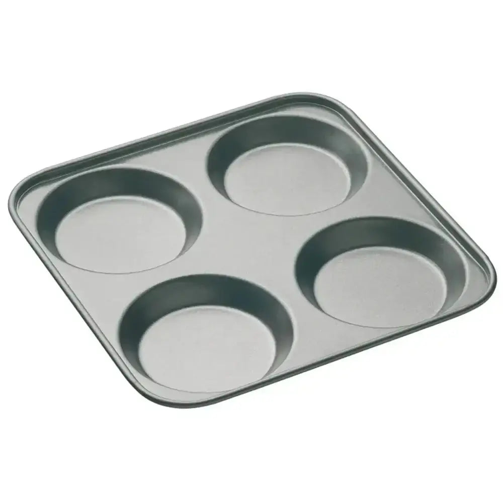 Metal muffin tray with four compartments on a white background