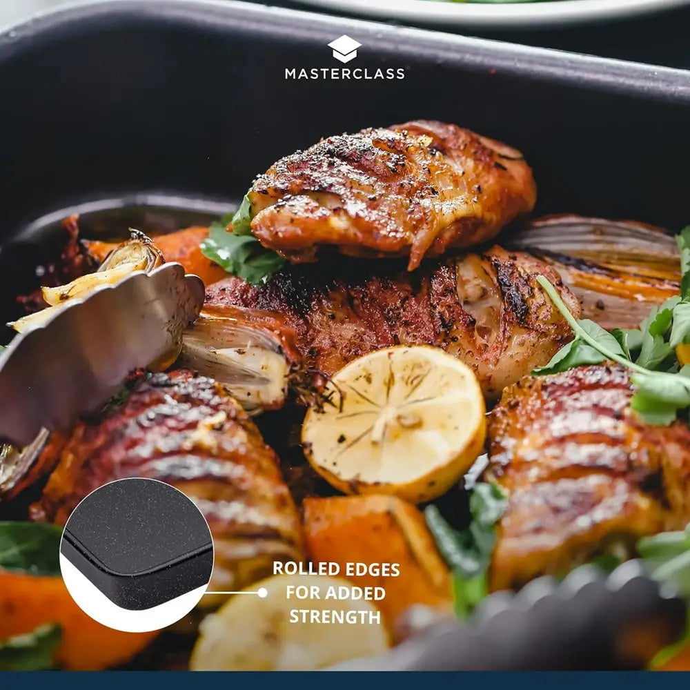 Grilled chicken with lemon and herbs in a pan, featuring Masterclass branding.