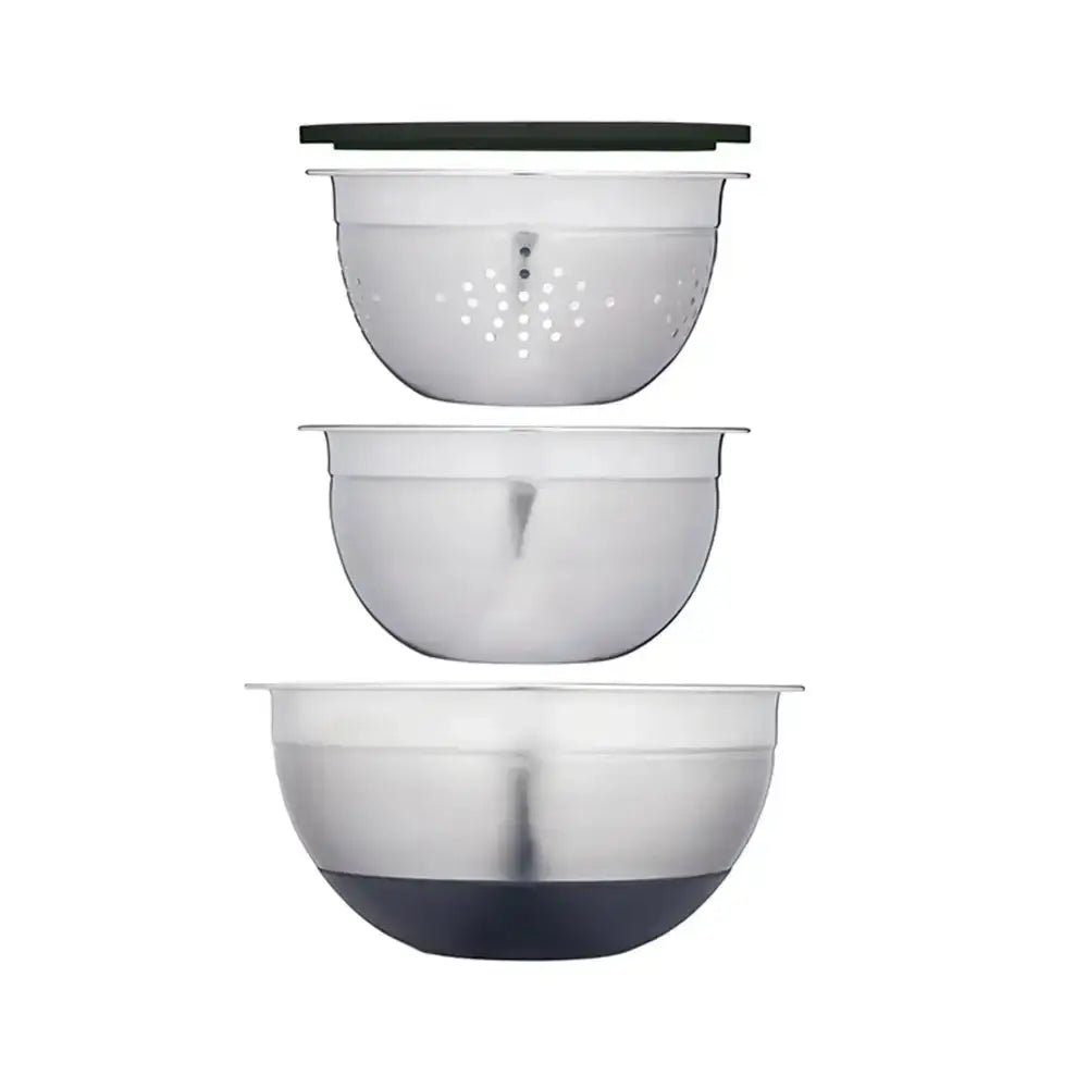 Set of three stainless steel mixing bowls with black bases on a white background
