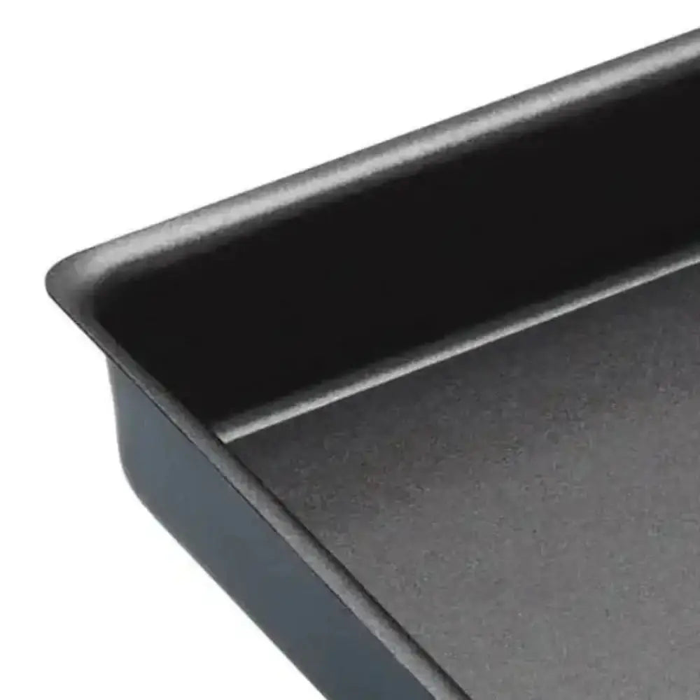 Close-up of a dark gray baking tray on a white background