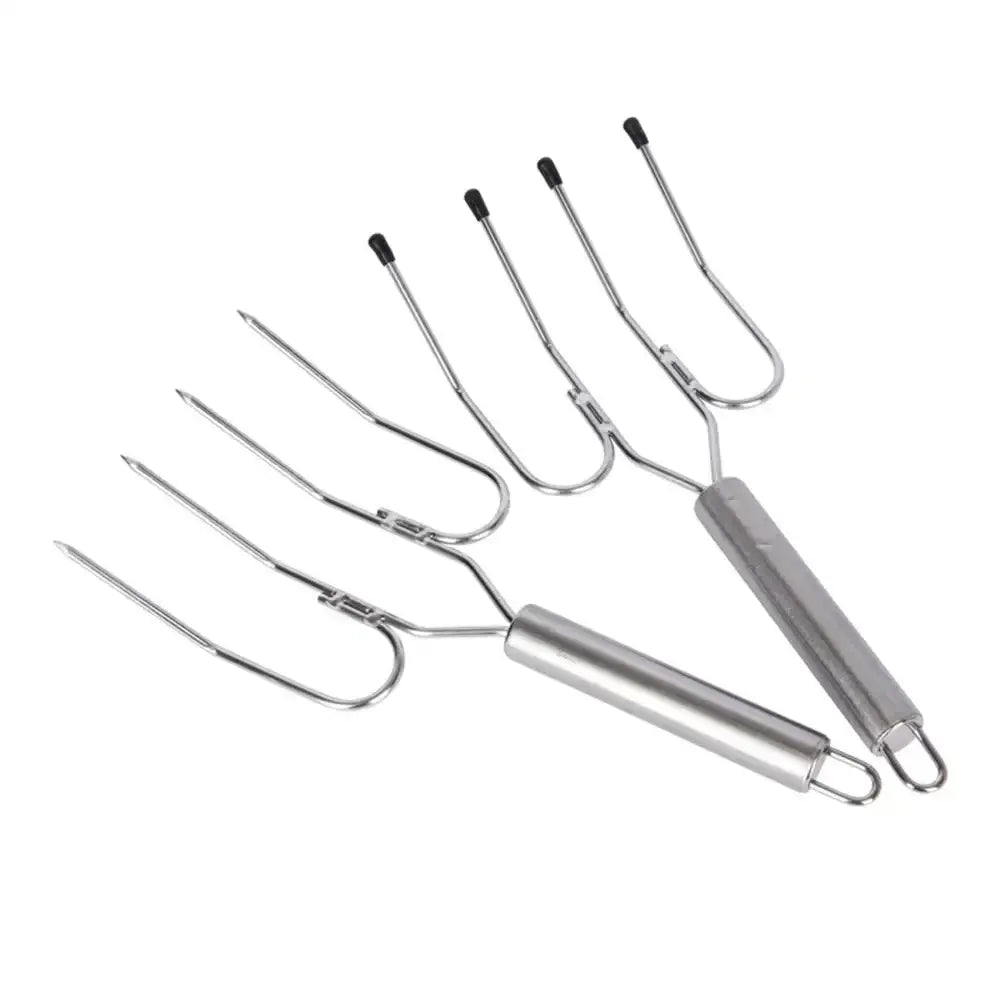 Set of metal barbecue tools on a white background