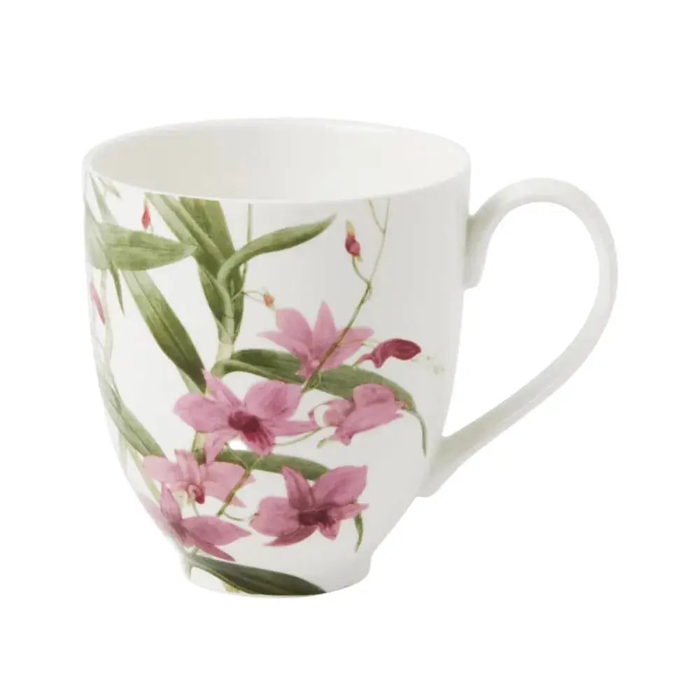 White mug with pink floral design on a white background