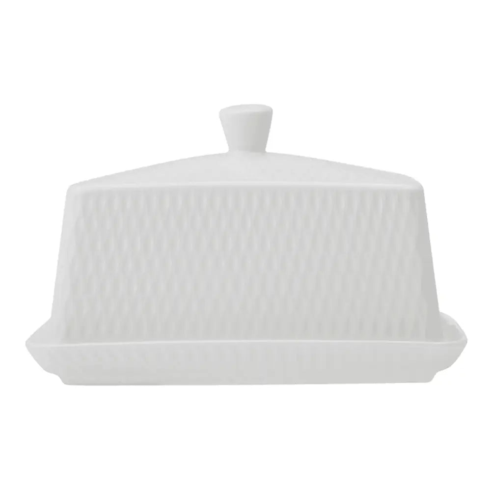 White ceramic butter dish with lid on a white background