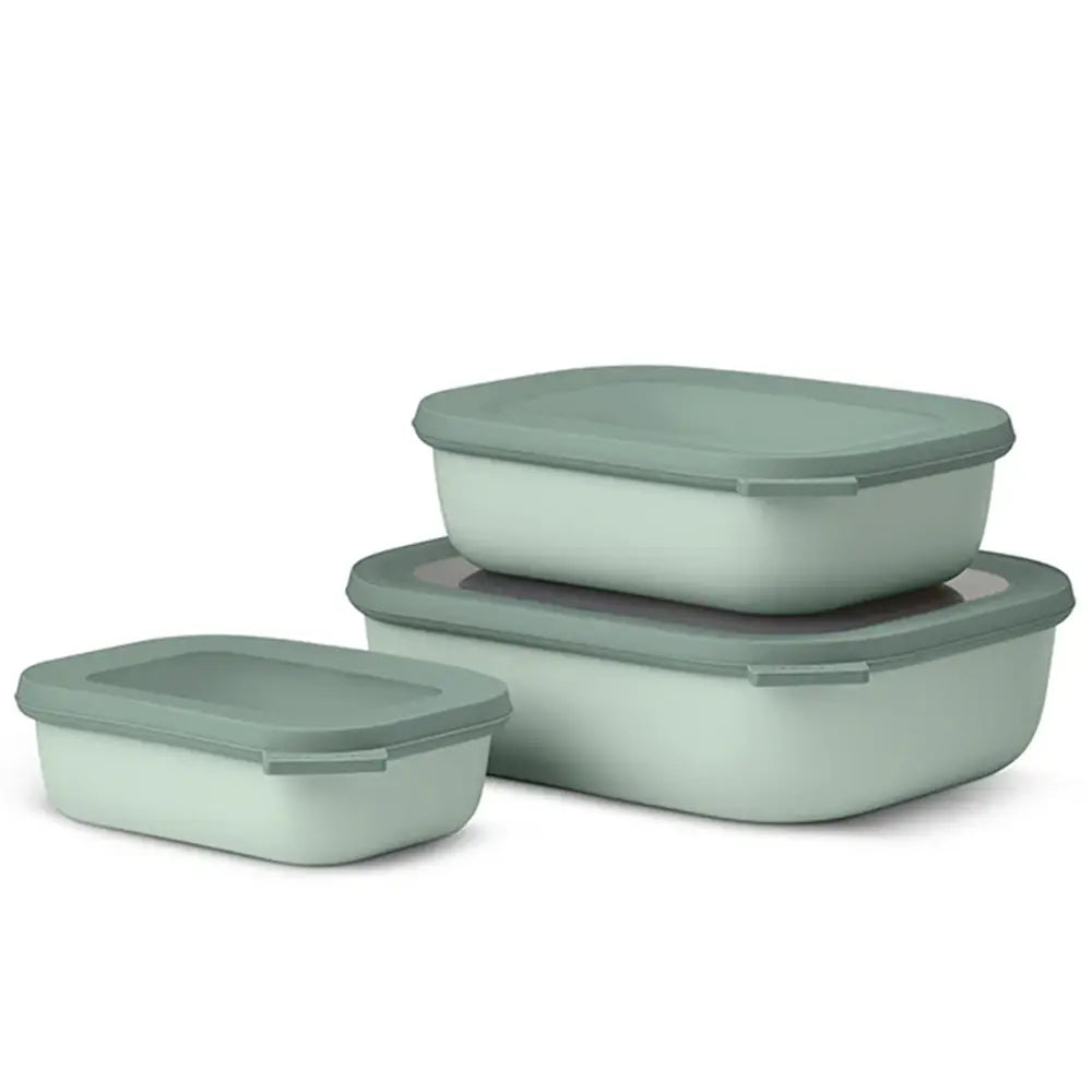 Set of three green food storage containers with lids on a white background