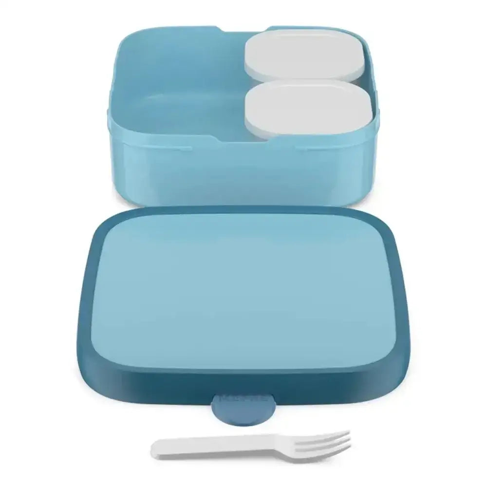 Blue bento box with compartments and a fork on a white background
