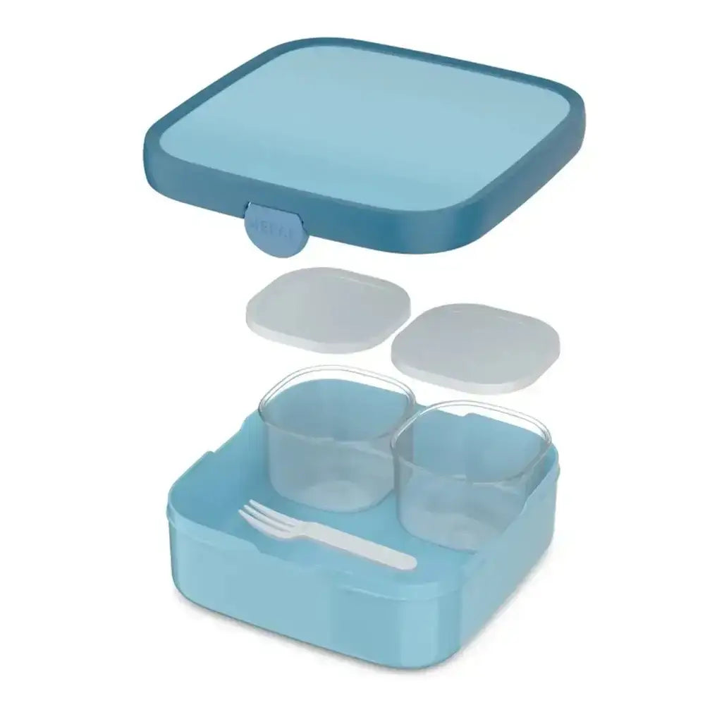 Blue bento box with compartments and a fork on a white background
