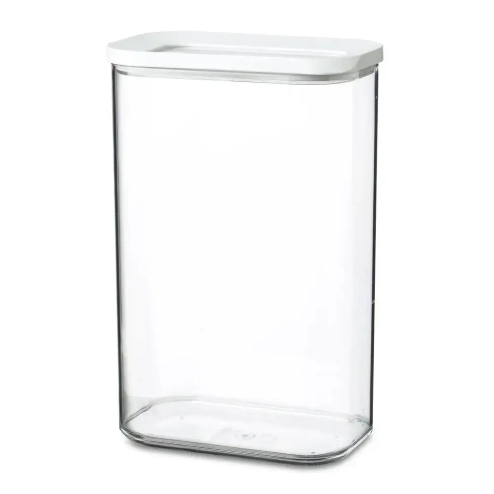 Clear glass storage container with a white lid on a white background