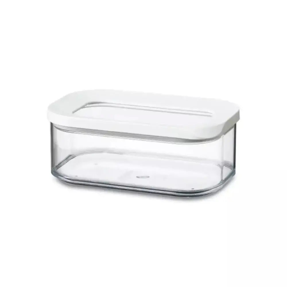 Clear container with a white lid on a white background