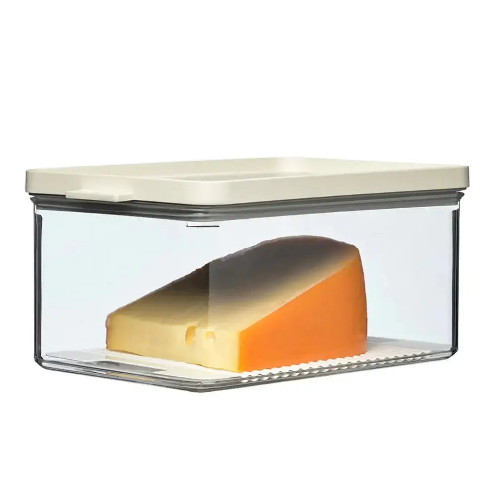 Clear glass container with a block of cheese inside on a white background