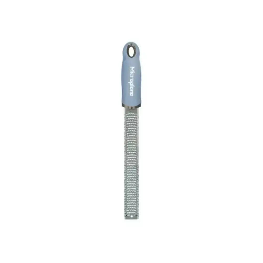 Microplane zester with blue handle on a white background