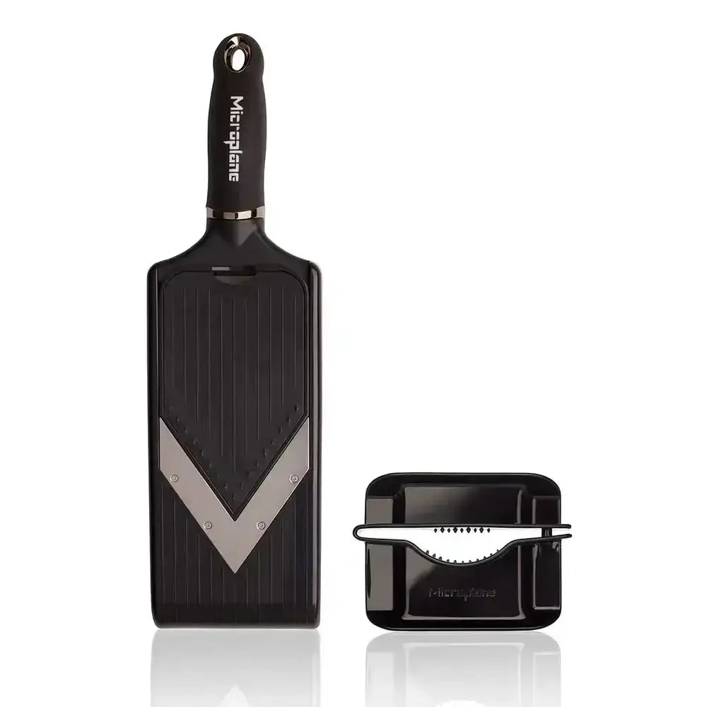 Black Microplane grater with attachment on a white background