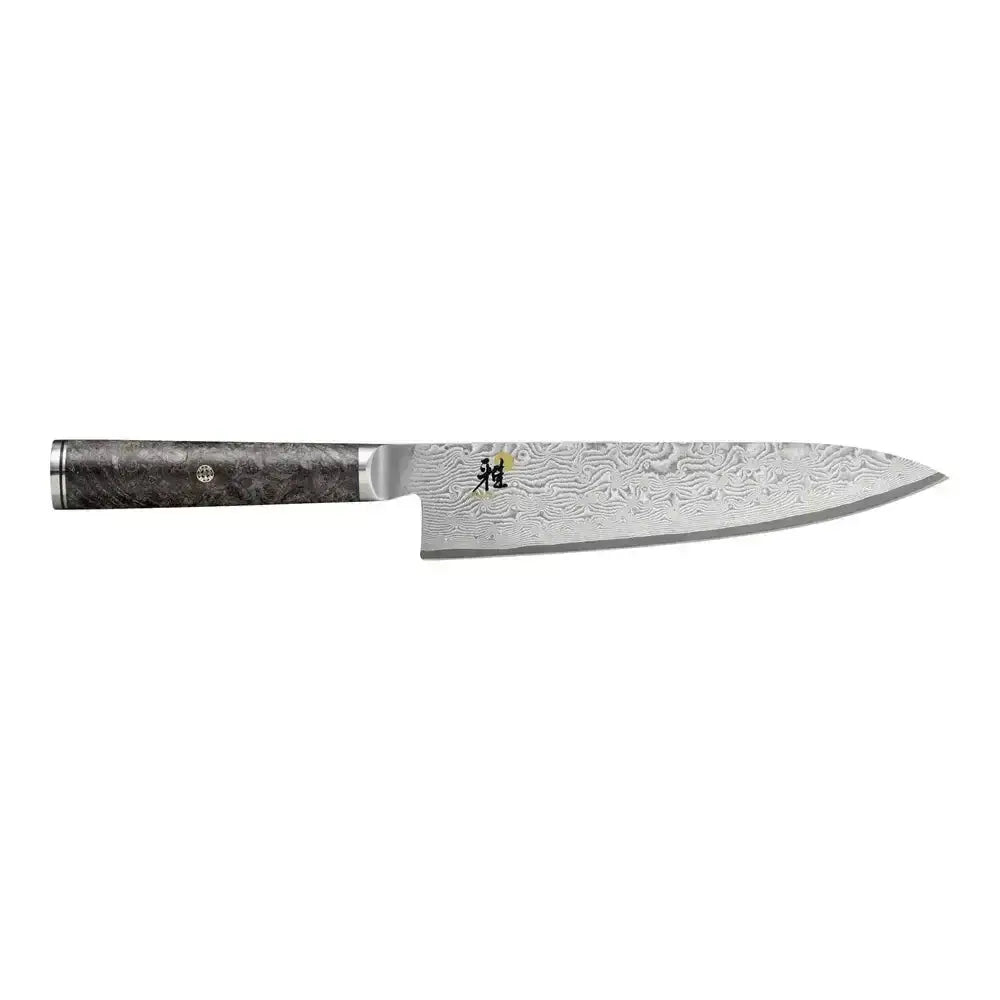 Chef's knife with a textured handle on a white background
