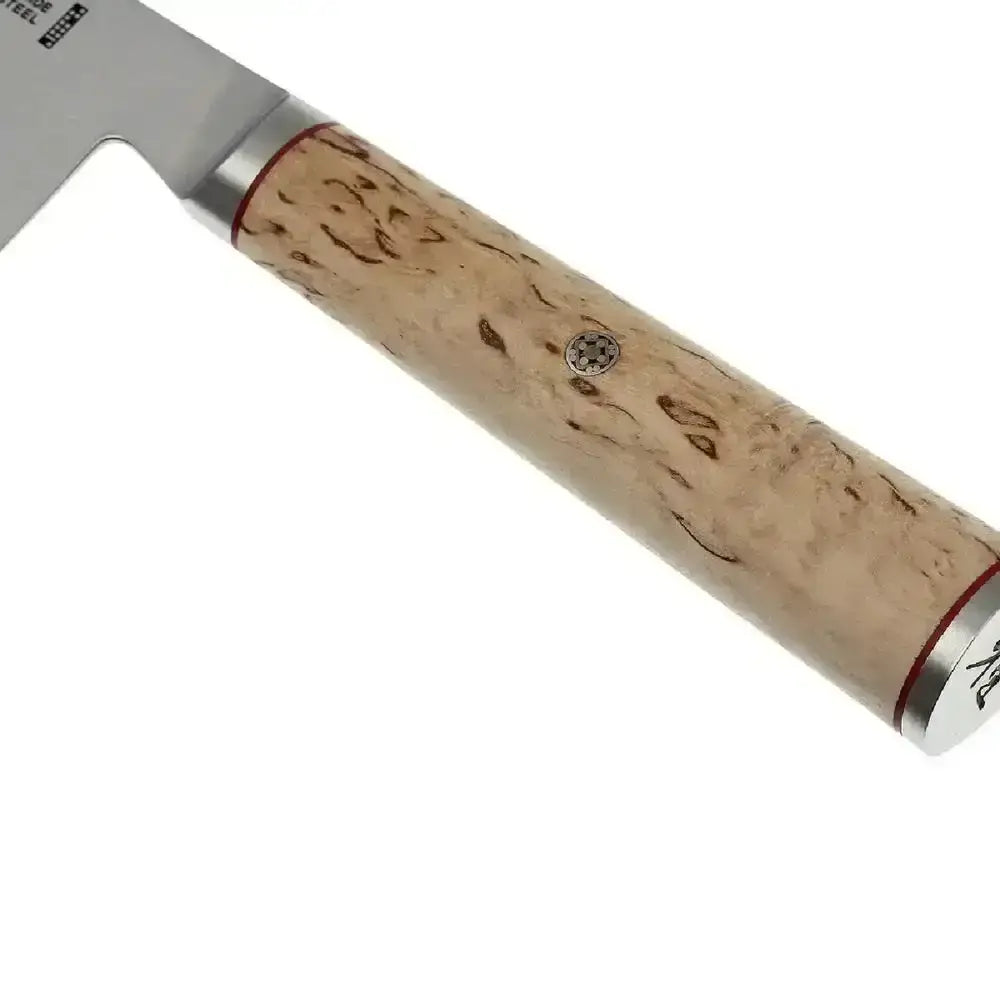 Close-up of a knife with a wooden handle on a white background