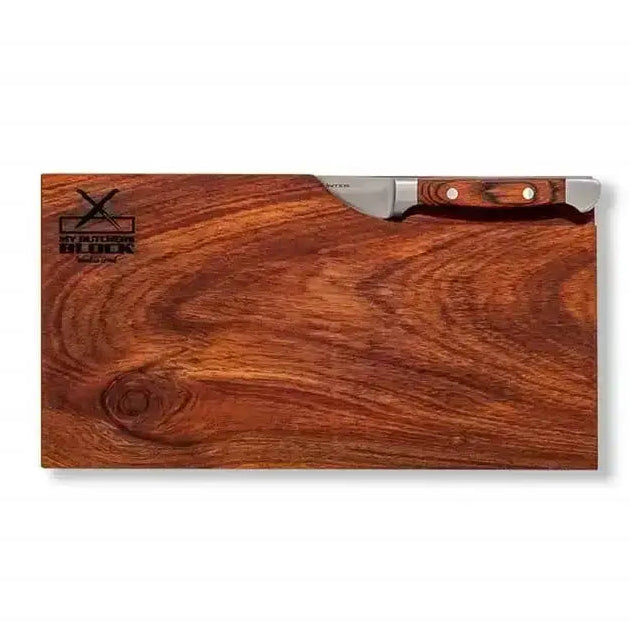 Wooden cutting board with a knife on a white background