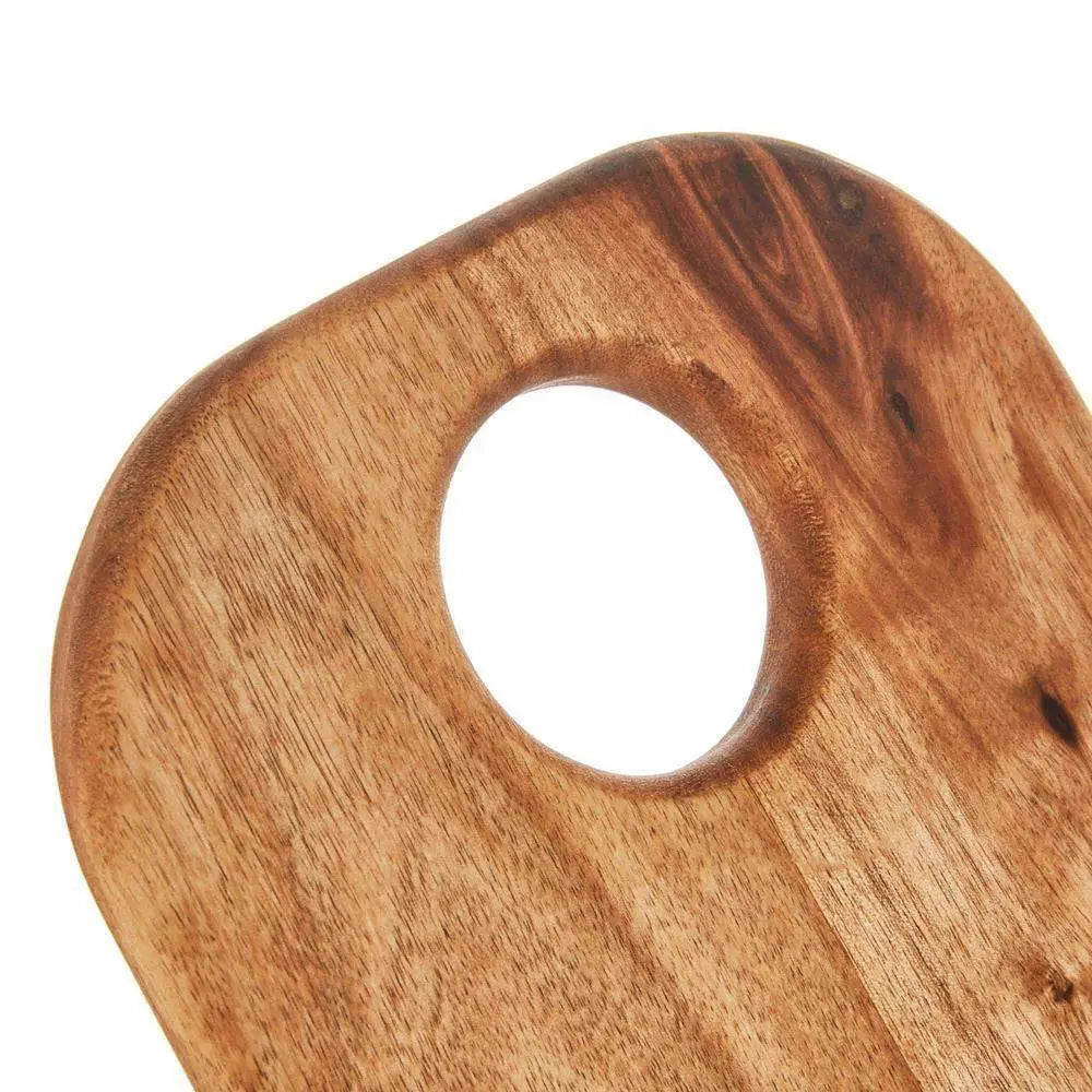 Wooden cutting board with a circular hole on a white background