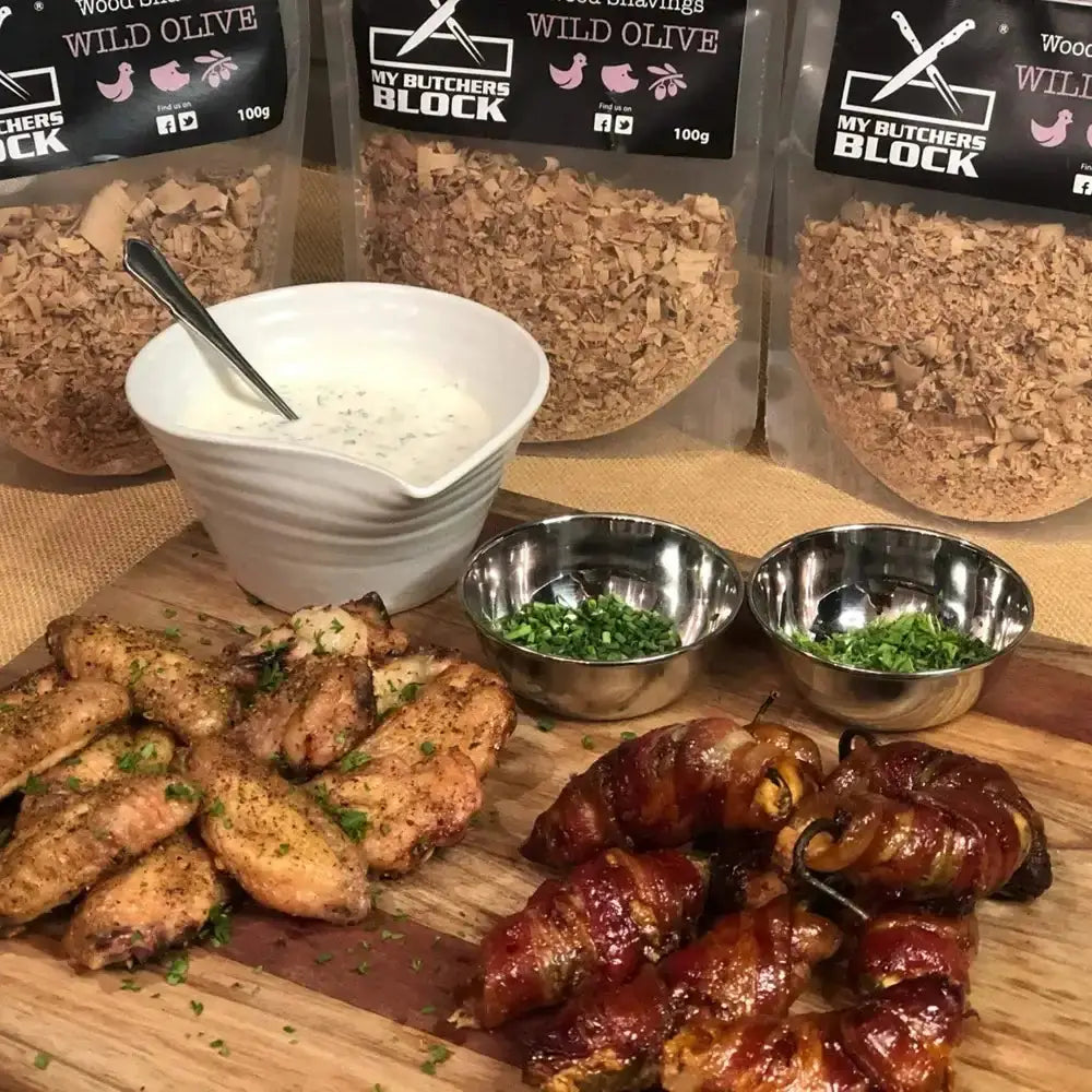 My Butchers Block food products with chicken wings and wrapped items on a wooden board.