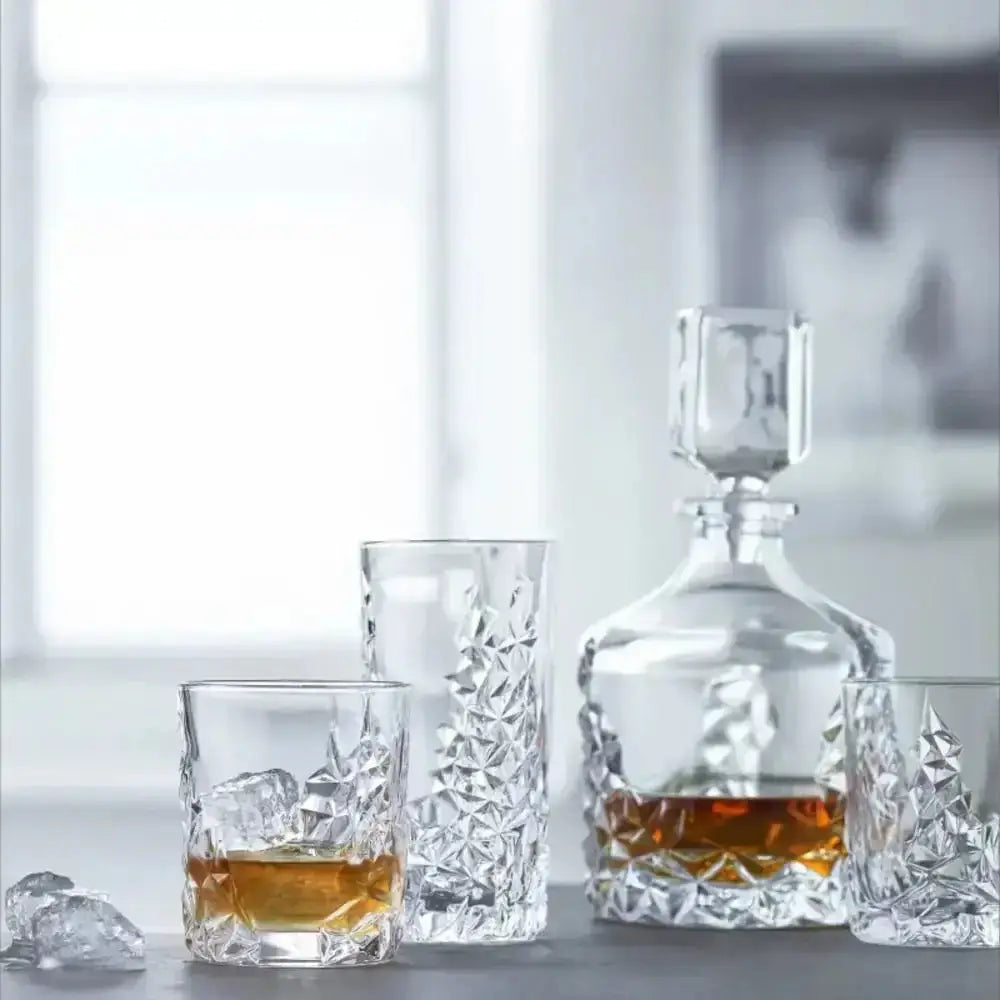 Nachtmann sculpture decanter filled with amber jan allure whiskey featuring faceted stopper and geometric cut patterns