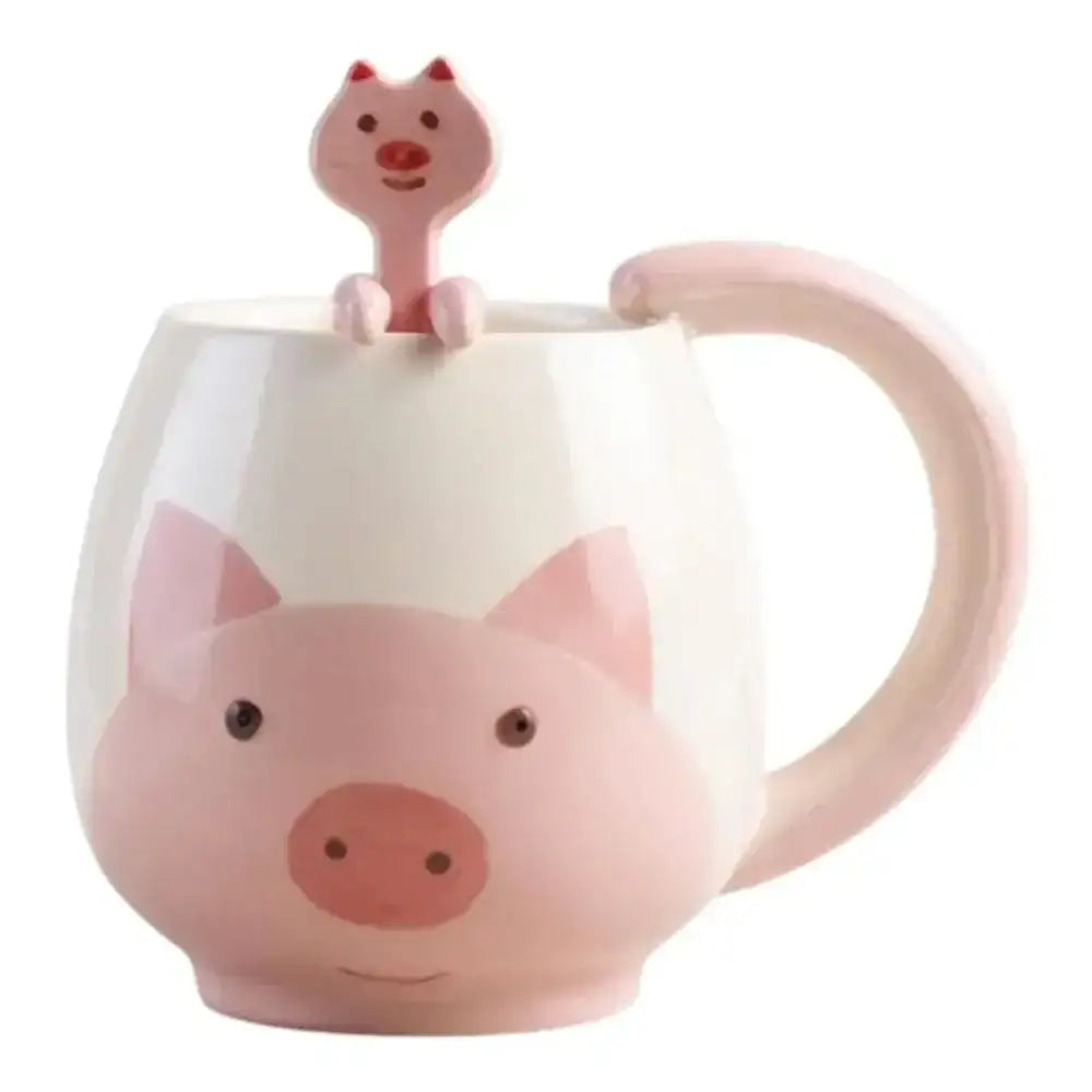 Pink pig-shaped mug with a matching spoon on a white background