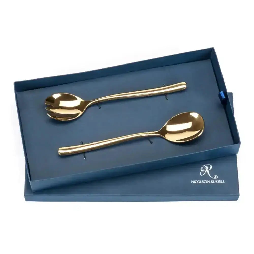 Set of gold spoons in a blue box with Nicolson Russell branding.