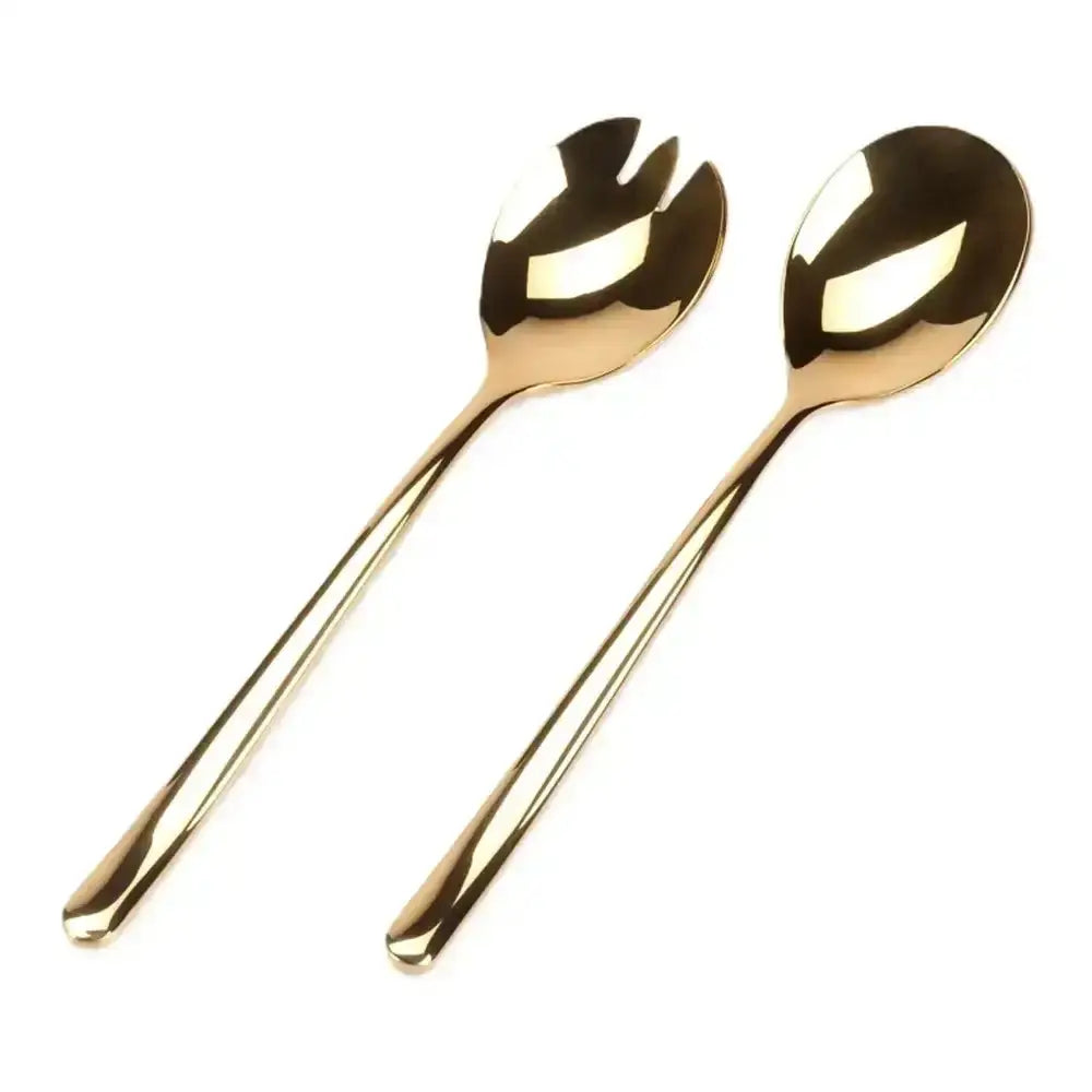 Two gold salad servers with leaf-shaped ends on a white background