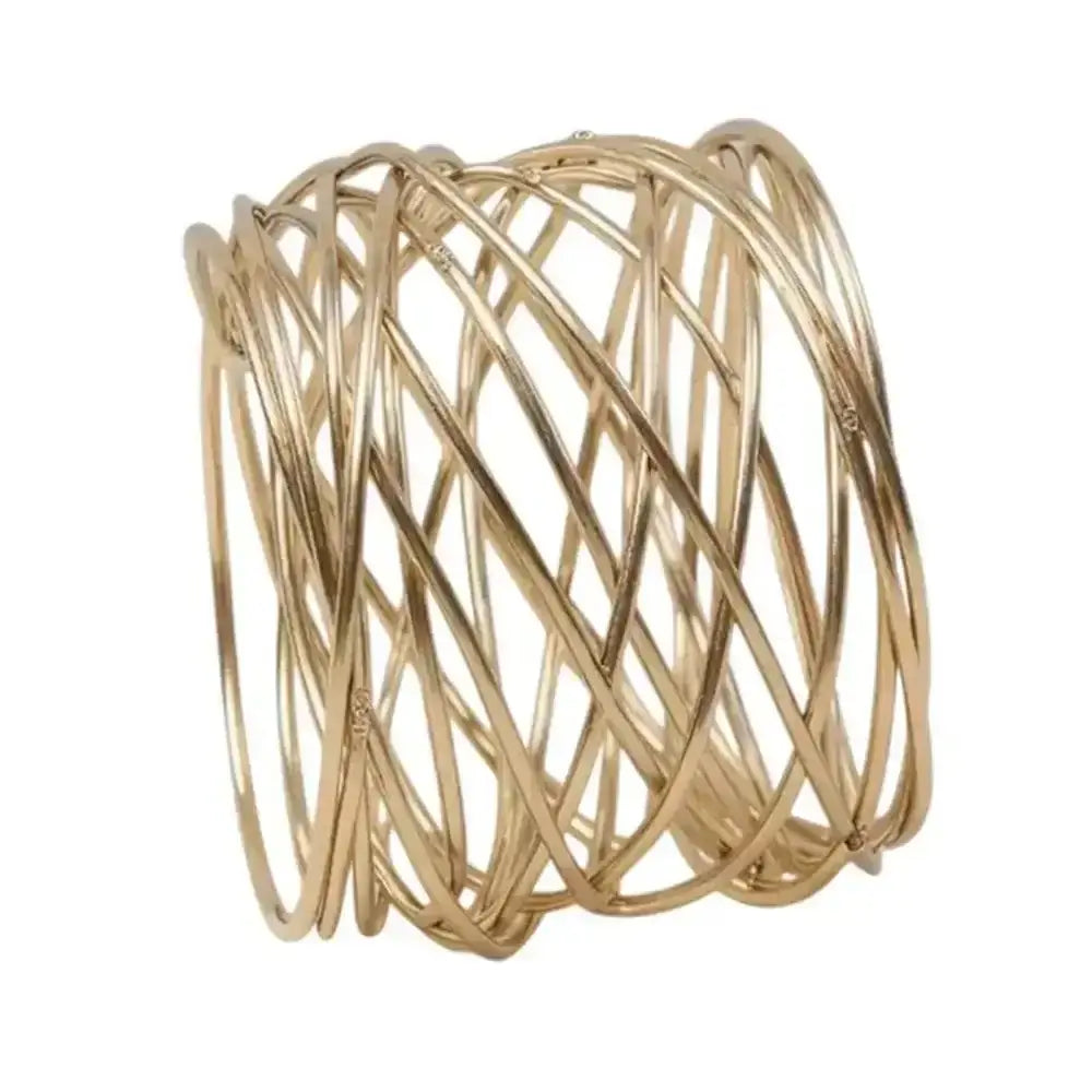 Gold wire rings on a white background