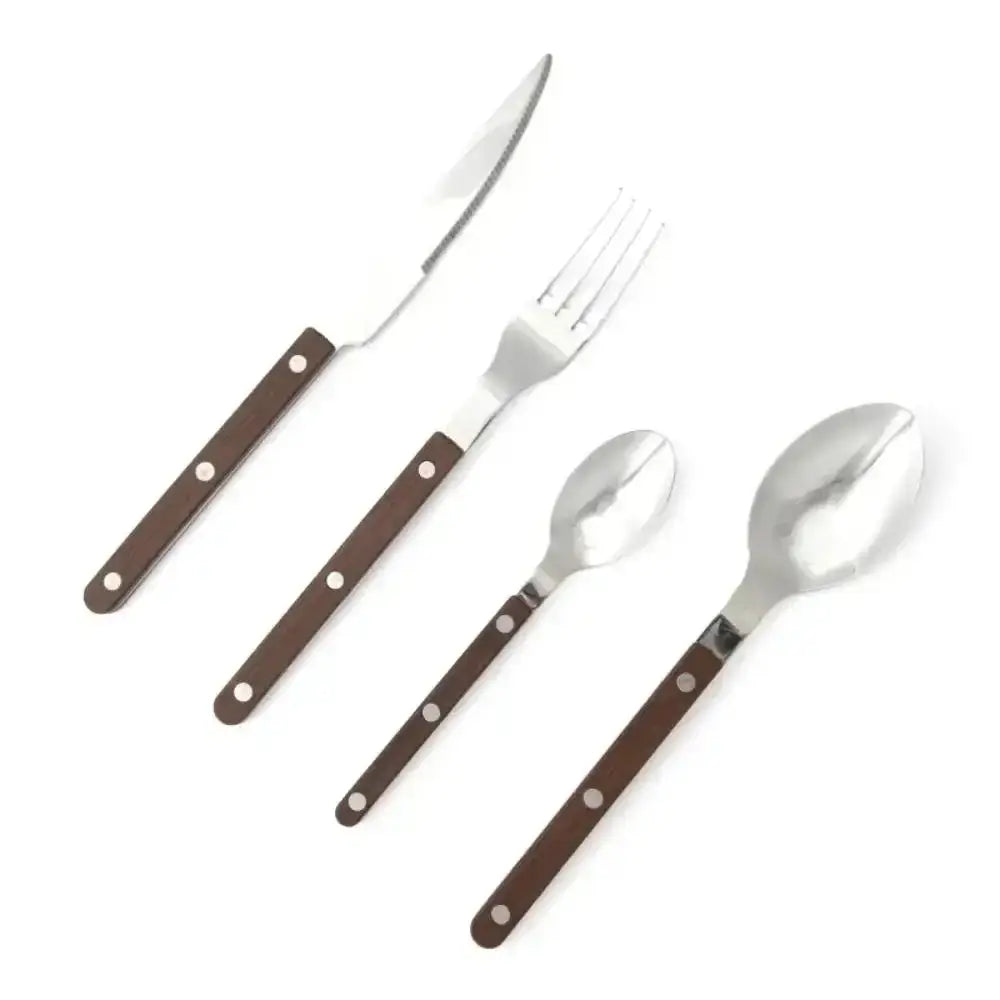 Set of cutlery with brown handles on a white background