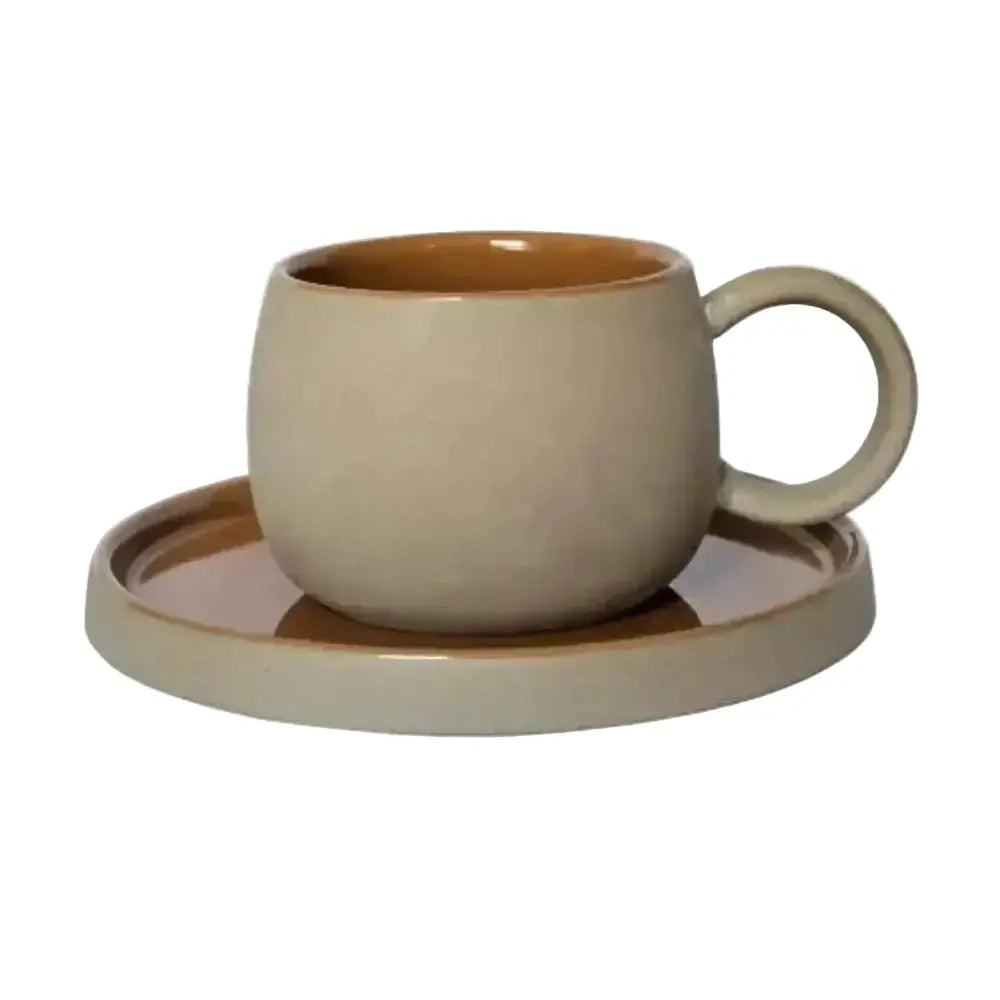 Beige ceramic cup and saucer set on a white background