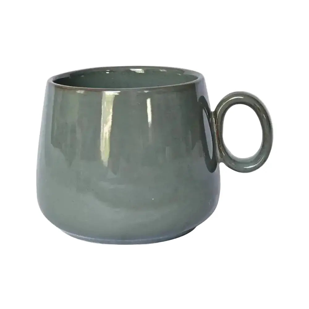 Gray ceramic mug with a round handle on a white background